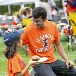 Family tailgating at Grange Grove on Game Day before Illinois football game.